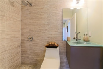 A bathroom with a toilet and sink in it